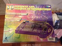 Front view of the 50 Projects lab kit box with colorful space-themed design and clear plastic case inside with electronic parts.