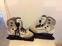 Side view of the left and right CCM ladies ice skates showing the brand, size, and overall condition.