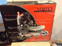 Box for Vortex inline skates showing features: light reflection, closure system, shell, frame, bearings, 70mm wheels.