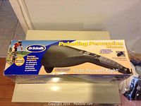 Top of the original box showing product name, brand, and product image.