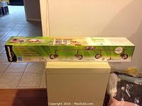 Box of Luminus Energy Saving 4-Head Tracklight Rail placed on floor with visible packaging and branding