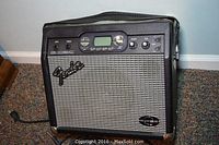 Full view of Fender amplifier showing front, speaker grille, and power cord.