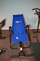 Blue AB Lounge 2 exercise chair, fully assembled, showing complete view from front and backrest with logo.