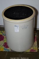 Front and side view of the beige stoneware crock, showing blue crown with number 15 mark and overall shape and size.
