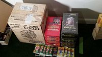 Wide shot of the entire case and stacks of boxes showing the 1991 Studio branding and other box types arranged on a table.