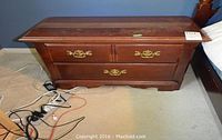 Full view of the Thomasville night table showing two drawers with brass handles and overall shape.