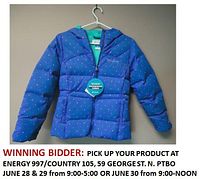 Front view of blue Columbia Glam Down jacket with pink dots, zip pockets, hood, and waterproof fabric tag.