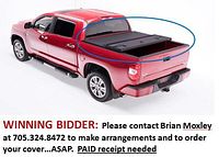 Three-panel matte black tonneau cover installed on red pickup, highlighting folding design and textured finish