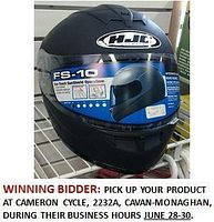 Black HJC FS-10 full-face helmet with clear visor and product label. Helmet is displayed on a metal rack.