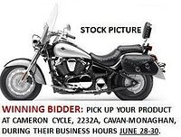 Stock side-view image of the 2007 Kawasaki VN900 Classic LT motorcycle showing black and silver body, windshield, saddlebags, backrest and floorboards.