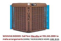 Front and side of brown outdoor condenser unit with York logo