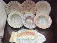 Seven pieces displayed together: six bowls and one fish platter