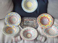 Overview of entire lot: six bowls, six napkin rings and rectangular tray arranged together