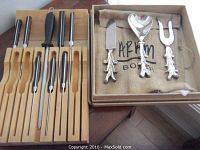 Photo showing Wusthof knives and utensils with wooden knife block.