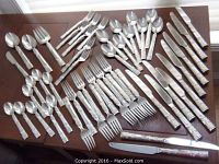 Assortment of flatware pieces arranged on tabletop