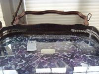 Photo showing both trays stacked; top tray is curved wooden with brass handles and glass insert; bottom tray is copper silver plated with pierced borders and grape leaf design handles, glass insert with marble patterned plastic beneath