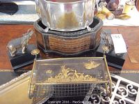 View of all items showing elephant bookends, silver wine chiller on wooden base, wooden box, and bronze tone magazine rack