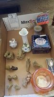 Photo showing all lot items including crystal candy box, stone figurines, vase, candle holder, and puzzle box.