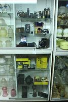 Second shelf with Minolta Autocord, Argus C3, lens accessory and leather cases