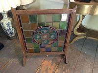 Front view of the wood framed stained glass fireplace screen showing overall size and structure.