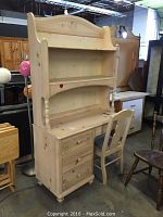 Full view of the Thomasville children's desk with attached shelves and chair.