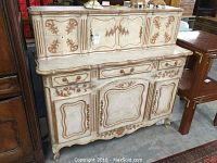 Front view of entire two-piece bonnet chest showing upper cabinet doors, lower drawers and cabinet doors