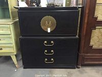 Front view showing upper double-door cabinet and lower three-drawer chest