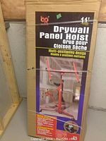 Front of unopened box showing model name and image of assembled hoist