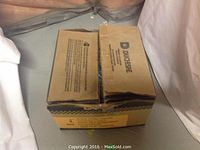 Closed cardboard box labeled DuBose containing nails.