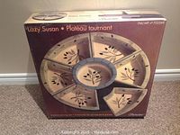 Original boxed 8-piece Signature Lazy Susan serving set showing arrangement and product branding.