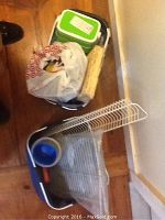 Photo of two blue canvas handle storage bags containing picnic and serveware items and some plastic containers.