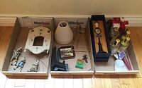Overview of all items arranged in cardboard boxes