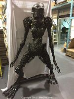Front full view of the assembled Alien sculpture showing overall form and stance.