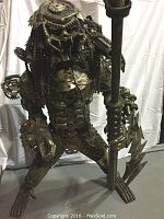 Front view of full Predator statue showing stance and overall form