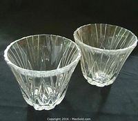 Pair of clear Waterford crystal cups with vertical ridged design and scalloped rims