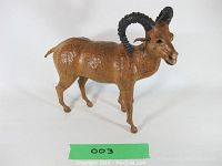 Front side view of the handcrafted vintage leather clad ram sculpture showing detailed textures and black curved horns.