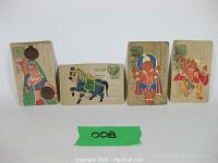 Front view of four hand painted vintage Indian postcards showing traditional subjects, including a woman, decorated horse, and two Ganesha figures.