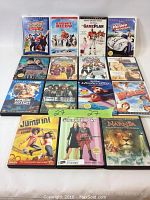 Photo of 15 assorted Walt Disney DVDs arranged in rows showing various family and adventure movie titles.