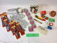 Full lot overview showing tassels, tapes, colored pencils, thread spools, blades, and additional craft accessories.