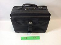 Front view of black Samsonite laptop attache bag showing handle, front buckle, zippered pocket, and label.