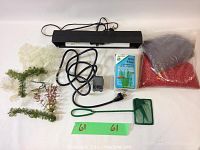 Black overhead aquarium light assembly, mini filter, small pump, artificial plants, colored gravel, and net displayed on white background
