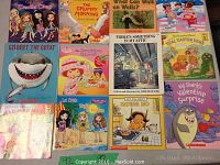 Image showing 12 assorted children's early reader books with colorful covers and themes including Bratz dolls, sharks, holiday themes, and classic storybooks.