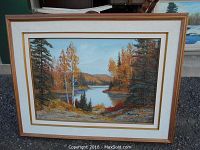 Framed original oil painting on board by Cole Bowman showing an autumn riverside landscape with trees and hills.