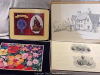 Four placemats showing Clan Fraser tartan and emblem, a village scene, floral design, and vintage illustrations.
