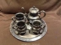 Full tea service set on tray including teapot with lid, creamer, sugar bowl, and tray