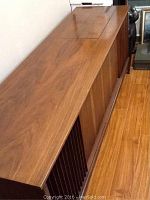 Top view of the wooden console stereo showing wood grain, top panels, and general condition.