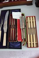 Two-piece Sheffield carving set with ivory/cream colored handles and a set of 6 knives with Bakelite handles in original Rogers box.
