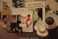Assortment of Royal Family books on Princess Diana, Queen Elizabeth The Queen Mother, plus a cup and saucer and framed stamps.