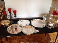 Full view of the lot displaying all items including the candelabra, bowl, and trays