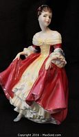 Front angled view of the Royal Doulton Southern Belle figurine showing her face, upper body, and detailed dress front.